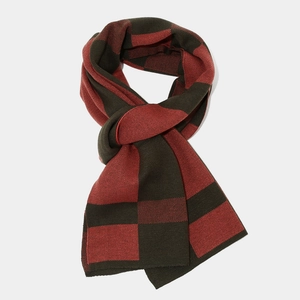Detail showing the red and green checkerboard knit scarf with high-density stitching