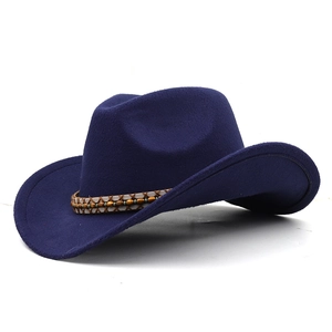 Detailed view of dark blue cowboy wool felt hat with woven bead band decoration