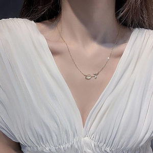 Elegant 925 silver tulip necklace with white chalcedony worn by model on neck