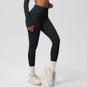 Detail of high-waist black yoga leggings with moisture-wicking fabric and seamless stitching