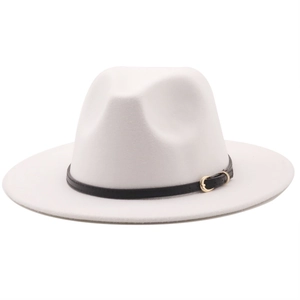 Detail of the white wool felt fedora featuring a black ribbon and gold metallic buckle