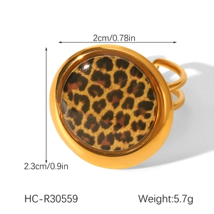 Detail view of 18K gold plated stainless steel ring with leopard print and size specs
