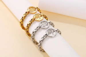Detailed view of gold and silver Tree of Life bracelets with sparkling rhinestone accents