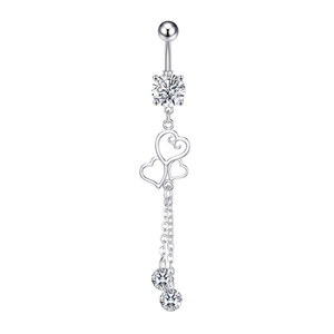 Close-up of silver belly ring with large zircon and triple heart dangling chains