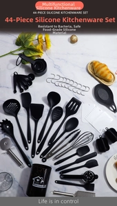 Detailed 44-piece set of black silicone kitchen utensils on a white marble background