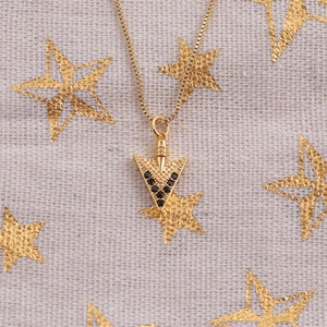Golden arrow pendant necklace with black zircon stones on a gold box chain accessory