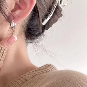 Elegant 925 sterling silver hoop earrings with textured finish on model with French style