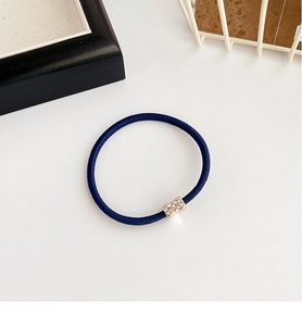 Detail of navy blue high-elastic hair tie with sparkling rhinestone metal buckle