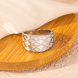 Detailed view of silver quilted pattern wide band ring with adjustable open design