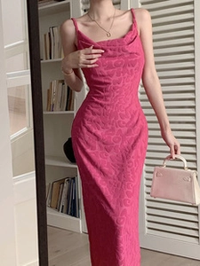 Detail of rose pink slip dress showing slim fit cut and elegant letter jacquard fabric texture