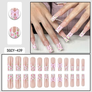 Long coffin press-on nails with pink rose design, French tips and 3D ribbon accents