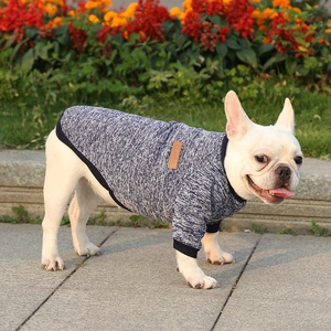 Close-up of heather blue knit pet sweater with a brown leather Classic label