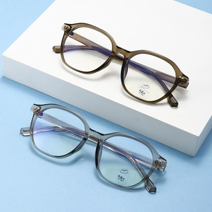 Detail of round retro eyeglasses frames showing anti-blue light and UV400 stickers