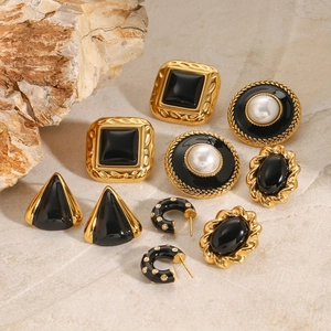 Vintage stainless steel earrings set in black and gold finish with pearl accents