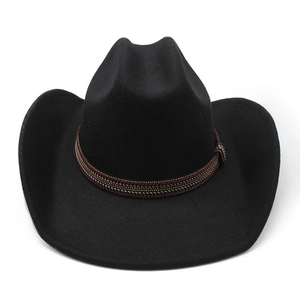 Detail of black wool cowboy hat featuring a distinctive red-brown and gold woven band