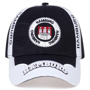 Detail showing the Hamburg city crest embroidery and white decorative stitching on a black cap