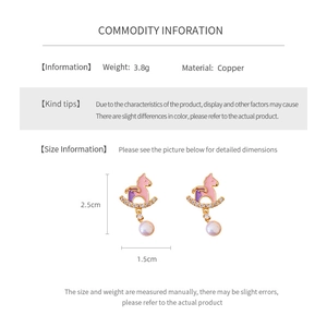 Detailed view of unicorn earrings with size chart, 3.8g copper weight and 2.5cm dimensions