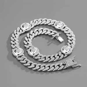 Detail of silver Cuban link necklace with sparkling rhinestones and folding clasp