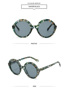 Detail view of round retro sunglasses in shiver black camouflage and dark grey lenses