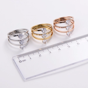 Classic triple-layer minimalist ring with clear cubic zirconia in silver, gold, and rose gold
