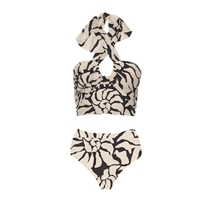 Detail of cross halter neck bikini top with abstract black shell print on beige fabric