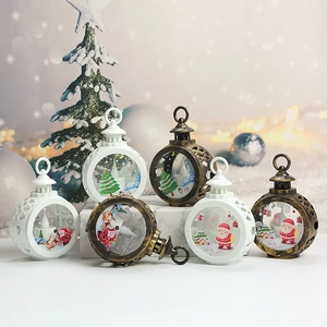 Detail of Christmas LED lanterns with Merry Christmas patterns and candle-shaped lights