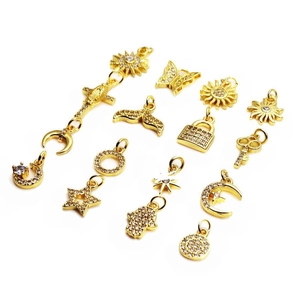Selection of gold-plated sun and butterfly charms with micro-paved cubic zirconia accents