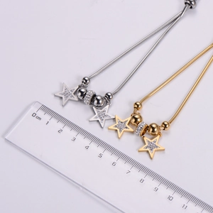Detail of star charm bracelet with zircon stones and adjustable sliding buckle clasp