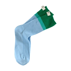 Blue and green color block skateboard socks with ribbed texture and heel labels