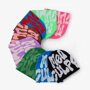 Y2K style acrylic knit beanies with jacquard Mea Culpa lettering in various colors