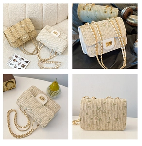 Detailed close-up of woven straw bag featuring floral embroidery and golden metal lock