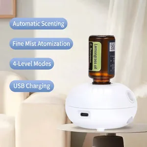 White cordless waterless essential oil diffuser with lemongrass oil for home or car use