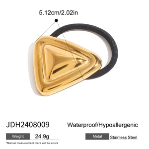 Detail showing a golden triangular stainless steel hair tie with product dimensions