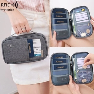 Detailed view of grey RFID blocking passport wallet interior with cards and cash slots