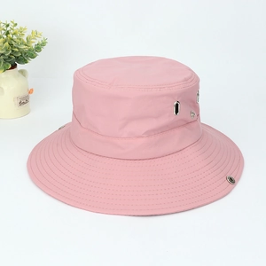Detail of pink hiking sun hat with breathable metal eyelets and adjustable snap brim
