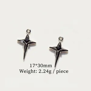 Detail of silver alloy star pendant with square black gemstone inlay and top ring
