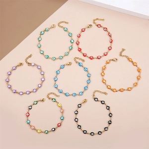 Golden stainless steel evil eye bead bracelets set with adjustable chains and lobster clasp