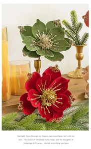 Close-up of red and green velvet Christmas flowers with gold glitter on petals
