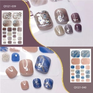 Detail view of waterproof toe nail stickers in purple and blue glitter styles