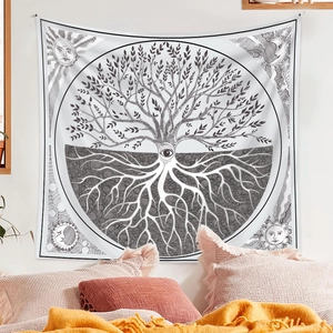Detail of bohemian black and white tapestry with tree of life and sun moon symbols