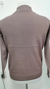 Close-up of the back detail on this solid-color V-neck knit cardigan with ribbed cuffs