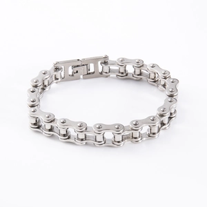 Close-up of industrial style silver stainless steel motorcycle chain bracelet