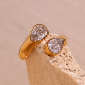 Macro shot of 18K gold plated stainless steel open ring with dual pear-cut zircon stones