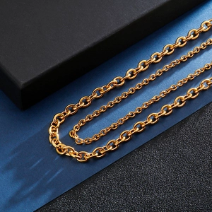 Classic gold stainless steel O-link chain necklace displayed on a luxury gift box