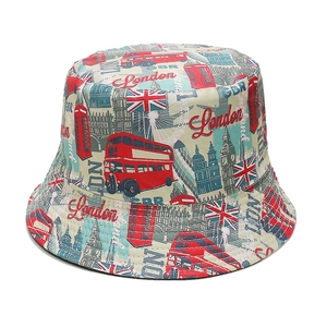 Detailed view of London landmark print bucket hat featuring red bus and Big Ben icons