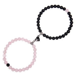 Close-up of pink zebra stone couple bracelets with magnetic heart-shaped connecting clasp