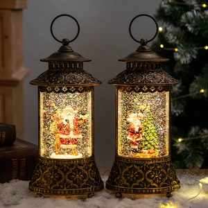 Vintage Christmas snow globe lanterns with Santa and tree, featuring warm lights and falling snow