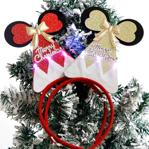 Luminous Christmas headbands with LED lights, festive red and gold glitter party favors