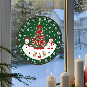 Close-up of a circular Christmas window sticker featuring Santa Claus and reindeer on glass