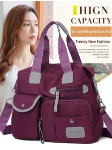 Purple nylon high capacity handbag with multi-pocket design for travel and daily commute